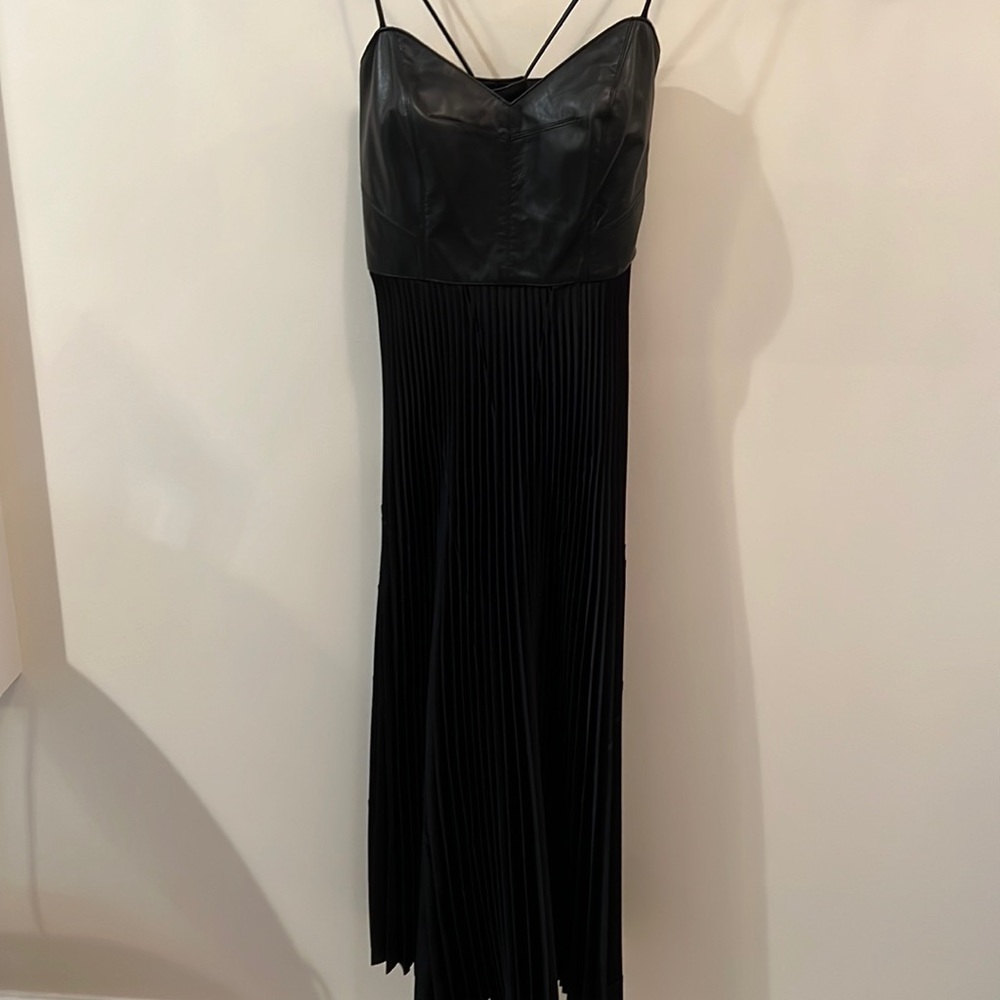 Black spaghetti strap midi dress with leather bodice and pleated poly skirt